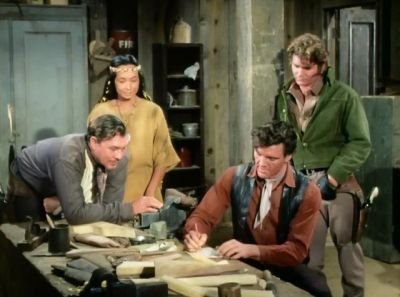 Candy and Joe helping Sgt. Samuel Bellis (Ben Johnson) and his wife, Nanata Bellis (Ellen Davalos) .jpg