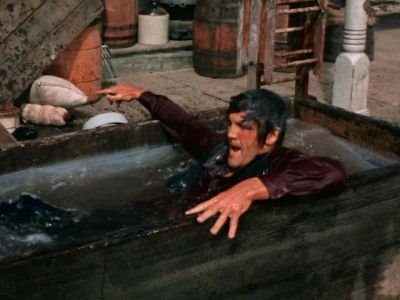 Candy ends up in a trough while fighting for a young woman's honor. s10 queen high.jpg